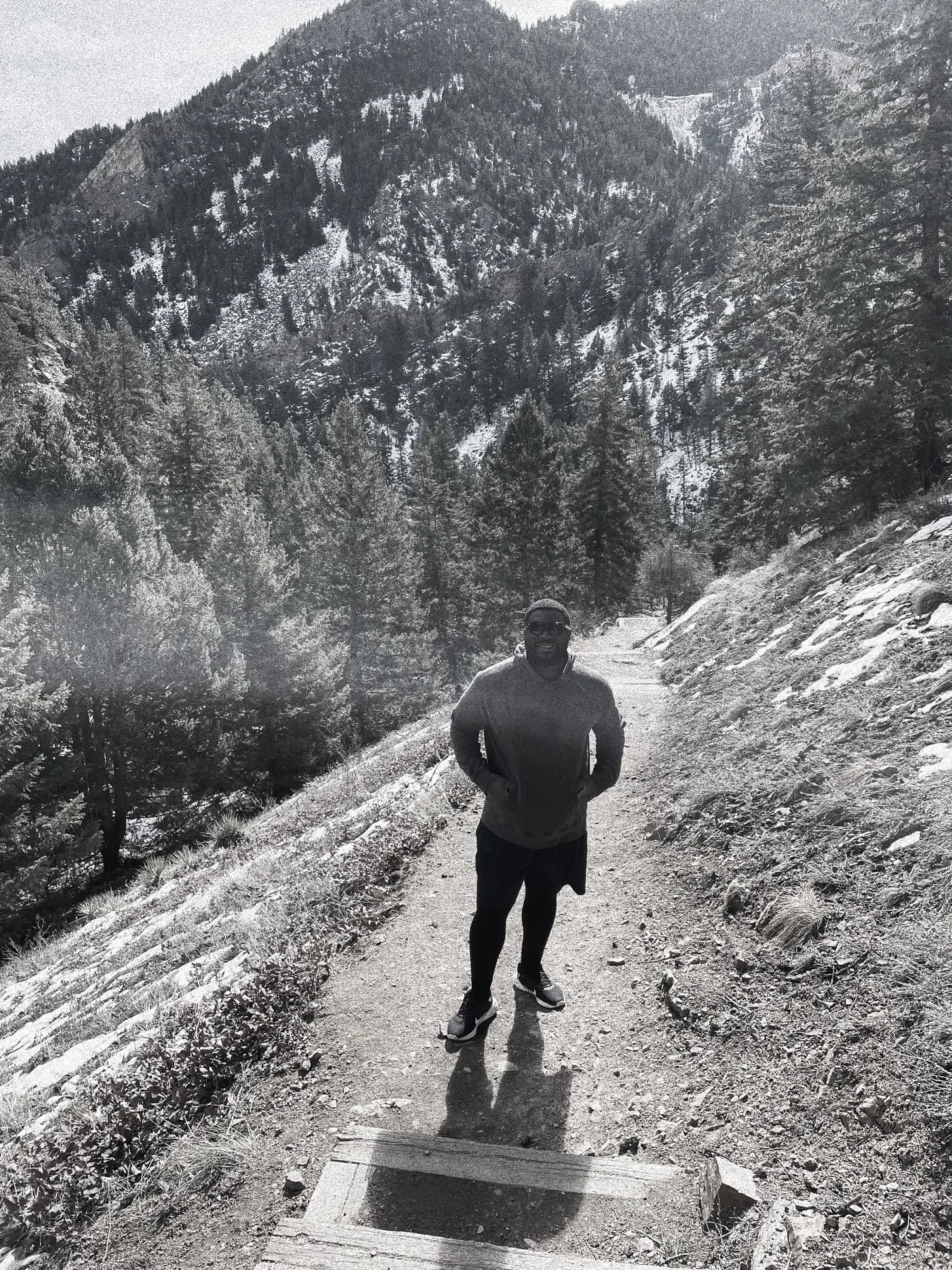 Dike Uche hiking on a mountain trail